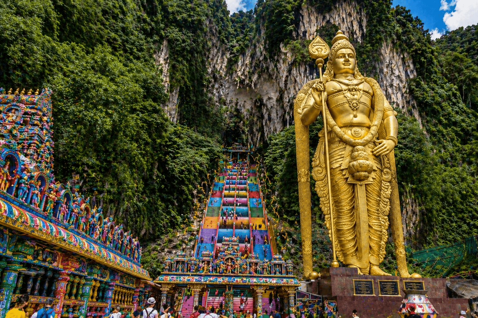 Batu Caves in Kuala Lumpur with colorful steps and Hindu temple entrance.